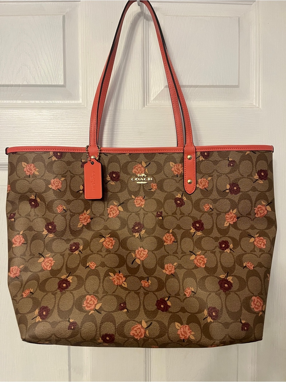 Coach Reversible Floral Monogram Tote Bag in Coral and Brown with coral hangtag